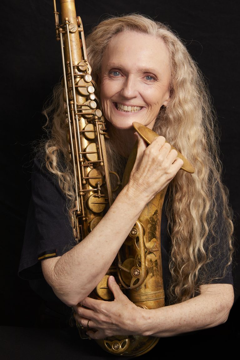 Sandy Evans holding tenor saxophone | Image credit Shane Rozario